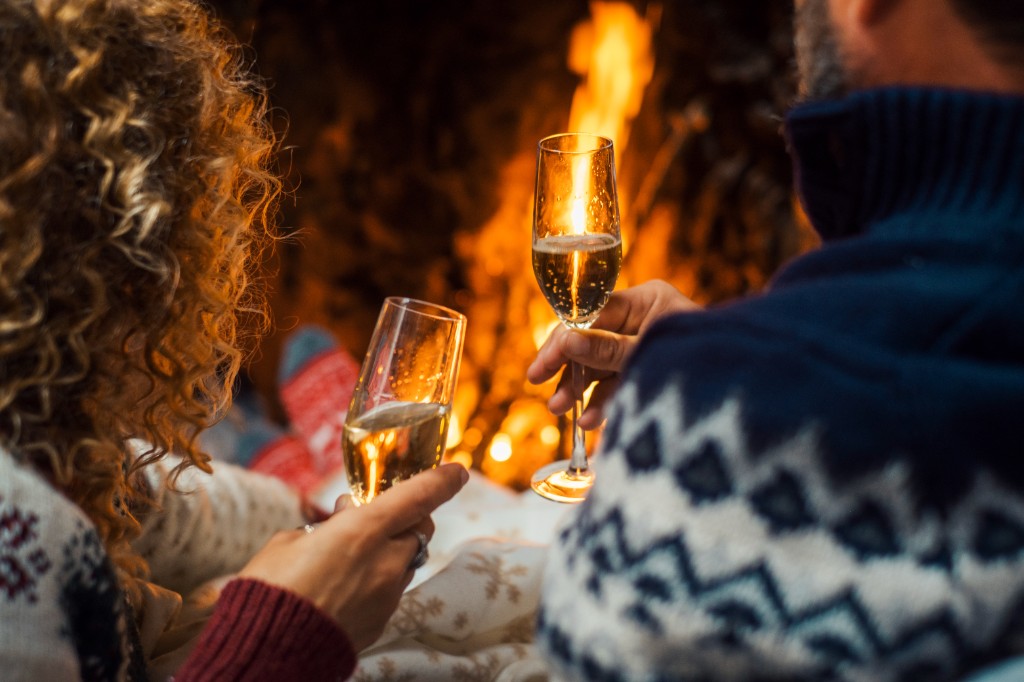 Couple enjoying a romantic evening by the fire