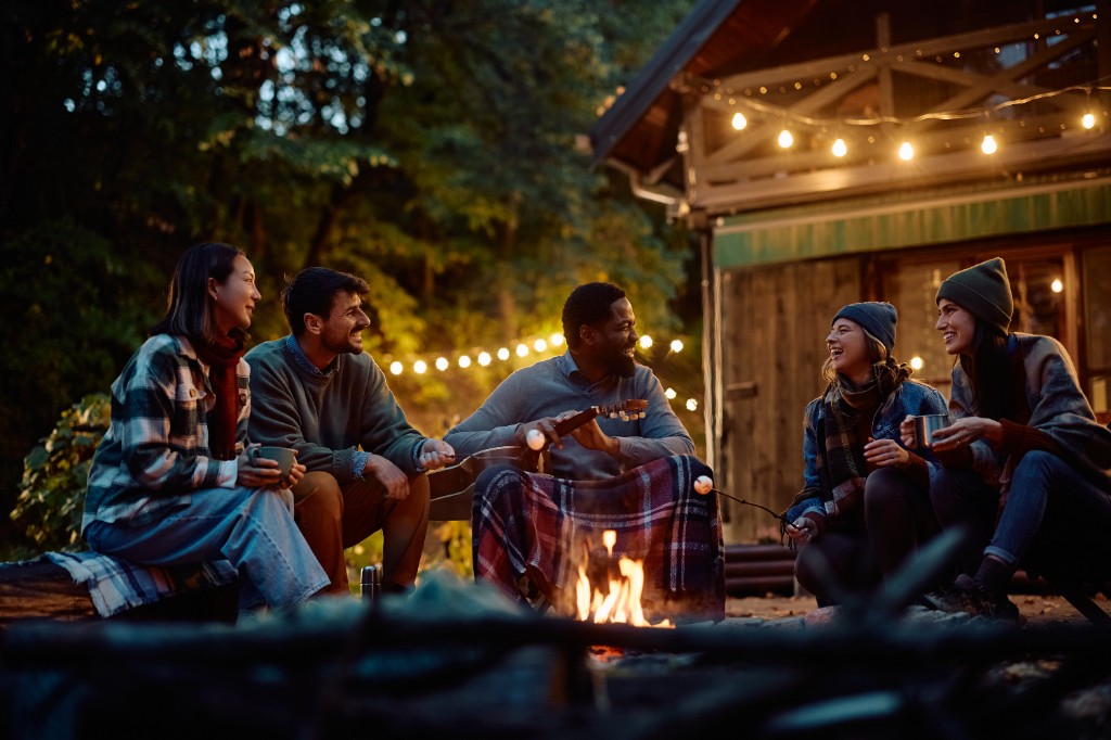 Group of friends around a campfire at Lakewood Reserve